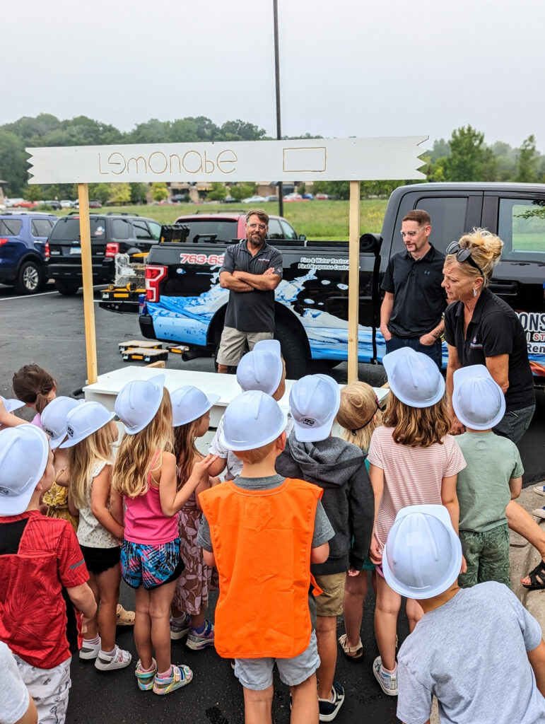 PXL_20230823_140622348.PORTRAIT building a lemonade stand for elk river new horizon academy