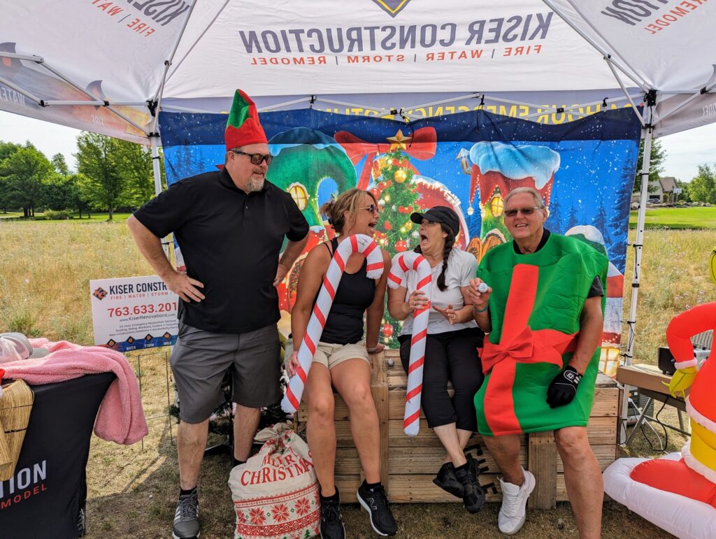 PXL_20230713_145919175 kiser construction christmas trees and tees photo booth 1